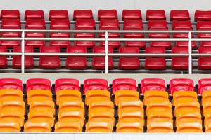 Rows of empty plastic stadium seats photo