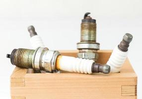 Spark plug in wood box photo