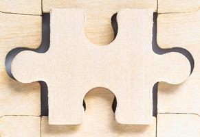 Blank wooden jigsaw puzzle photo