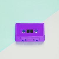 Flat lay retro colorful cassette tape on pastel color background, minimal style photo