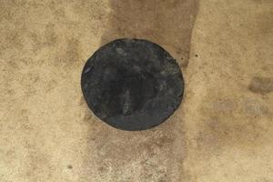 Close-up of an antique drum head surface. Natural leather texture background from the instrument - a percussion instrument for the music. photo