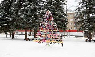 New Year's background with a Christmas wooden tree made of mittens photo