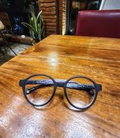 Glasses on a wooden table. photo