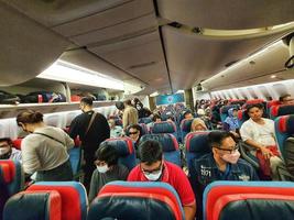 Situation from the cabin of a Turkish Airlines economy class plane where the seat consists of three parts, right, left and center. photo