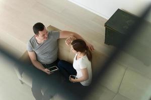 couple relaxing at  home with tablet computers photo