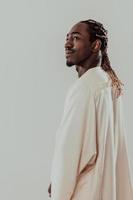 Portrait of handsome african black man in traditional islamin sudan fashion clothes. Selective focus photo