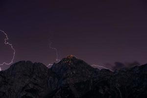Mountain illuminated by lightning