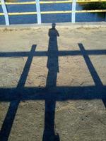 shadow of man on bridge background photo