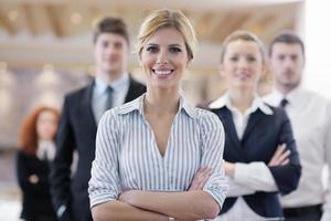 business woman standing with her staff at conference photo