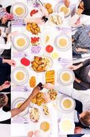 top view of modern multiethnic muslim family having a Ramadan feast photo