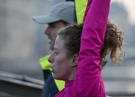 couple warming up before jogging photo