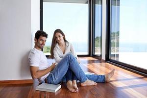 relaxed young couple at home staircase photo