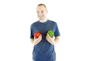 happy couple holding peppers with head photo