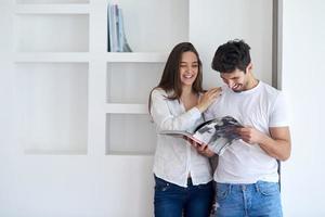 relaxed young couple at home staircase photo