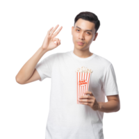 ung asiatisk man innehav popcorn Skära ut, png fil