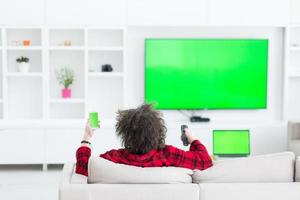 young man in bathrobe enjoying free time photo