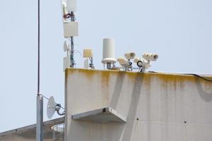 security cameras and telephone and radio antennas