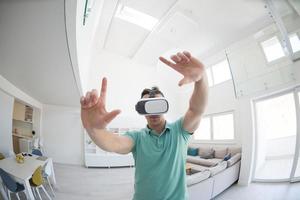 man using VR-headset glasses of virtual reality photo