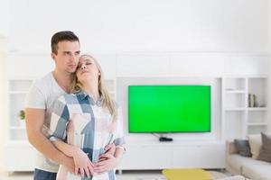 couple hugging in their new home photo