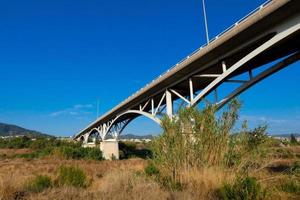 Modern river bridge, an engineering feat that thousands of vehicles pass over daily photo