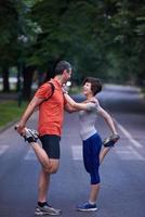 jogging couple stretching photo