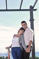 couple relaxing on balcony photo