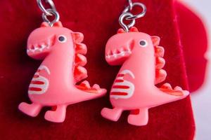 pink dinosaur earrings photo