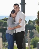 couple relaxing on balcony photo