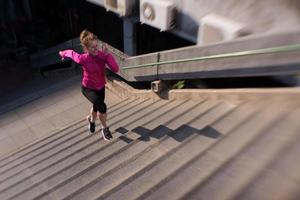 woman jogging on  steps photo