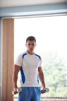 man exercise with weights photo
