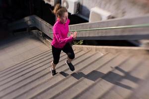 woman jogging on  steps photo