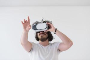 Man using headset of virtual reality photo