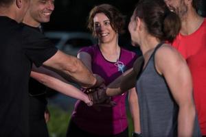 runners giving high five to each other photo