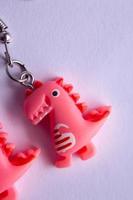 pink dinosaur earrings photo
