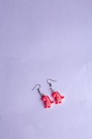 pink dinosaur earrings photo