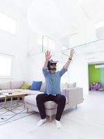 man using VR-headset glasses of virtual reality photo