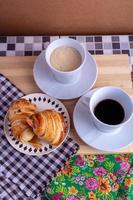 cup of coffee and croissant photo