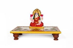 Beautiful Clay Idol of Hindu Goddess Lakshmi OR Laxmi on white background photo