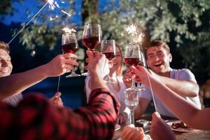 happy friends having french dinner party outdoor photo