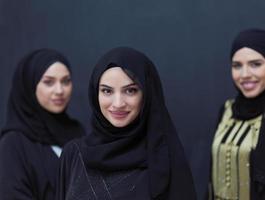 portrait of beautiful muslim women in fashionable dress photo