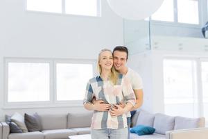 couple hugging in their new home photo