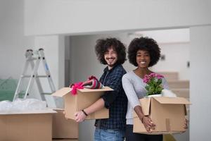 multiethnic couple moving into a new home photo