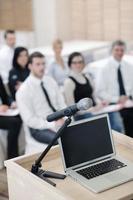 laptop on conference speech podium photo