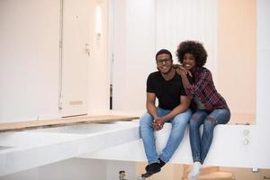 couple having break during moving to new house photo