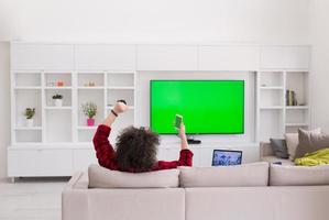 young man in bathrobe enjoying free time photo