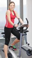 woman workout  in fitness club on running track photo
