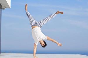 young man practicing yoga photo