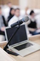 laptop on conference speech podium photo