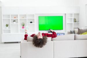 young man in bathrobe enjoying free time photo