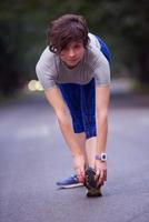 woman  stretching before morning jogging photo